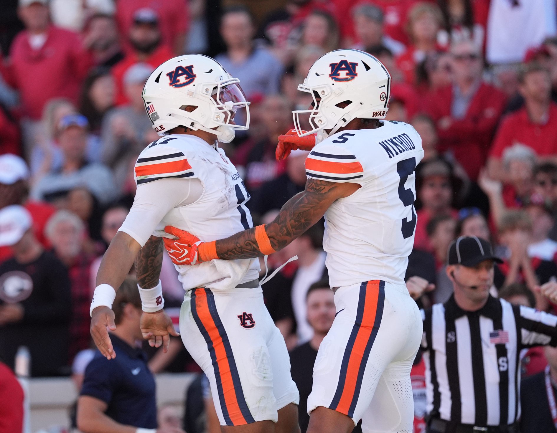 Auburn quarterback Byrum Brown (17) and wide receiver Chas Nimrod (5) celebrate a touchdown during the second quarter against Georgia at Sanford Stadium.