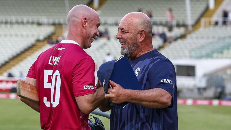 Northants Steelbacks batsman Chris Lynn shaking hands and smiling with coach Darren Lehmann after helping guide his side to victory against Warwickshire Bears in the T20 Blast