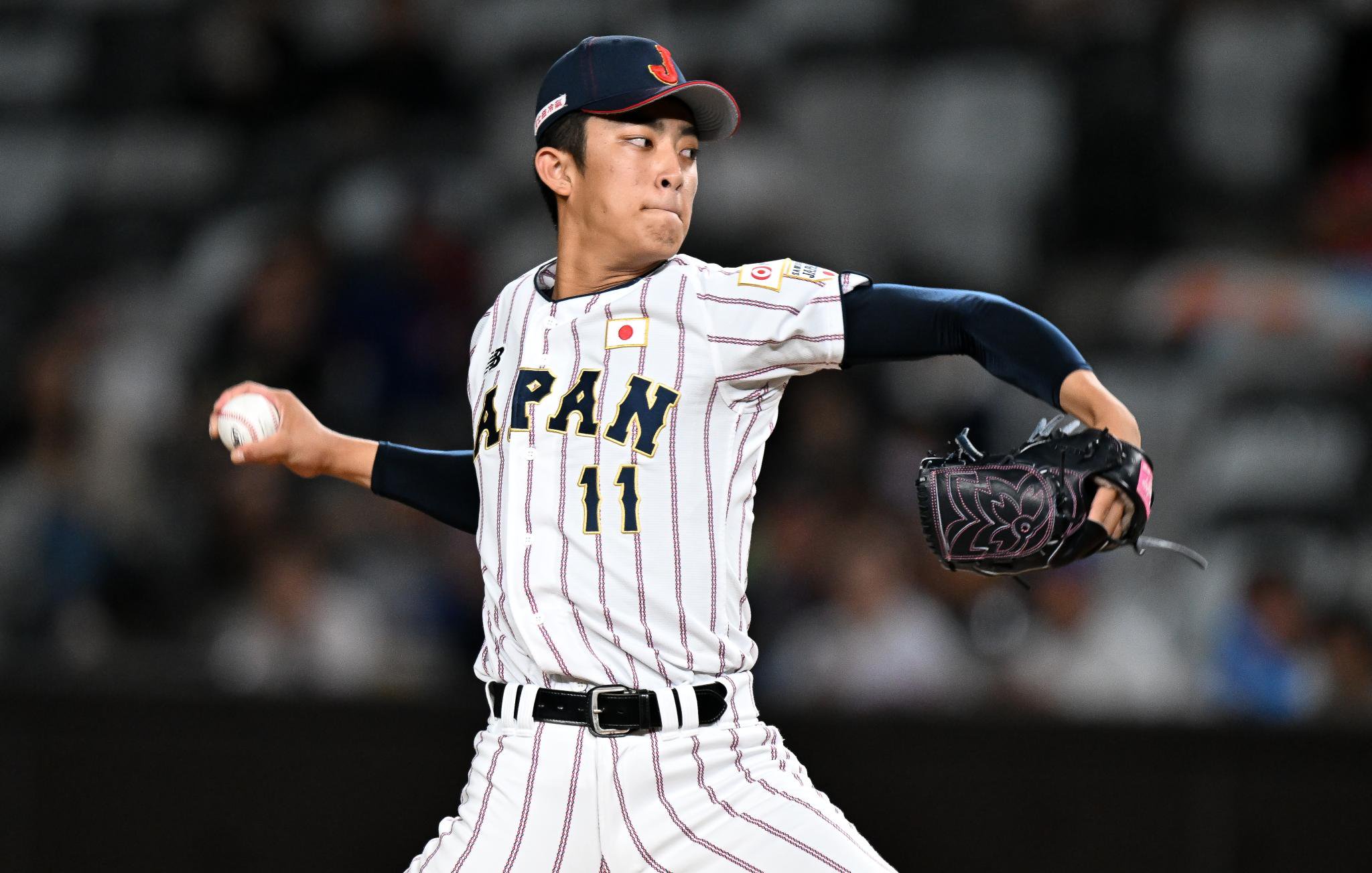Shoki Oda of Team Japan throws a pitch during a game.
