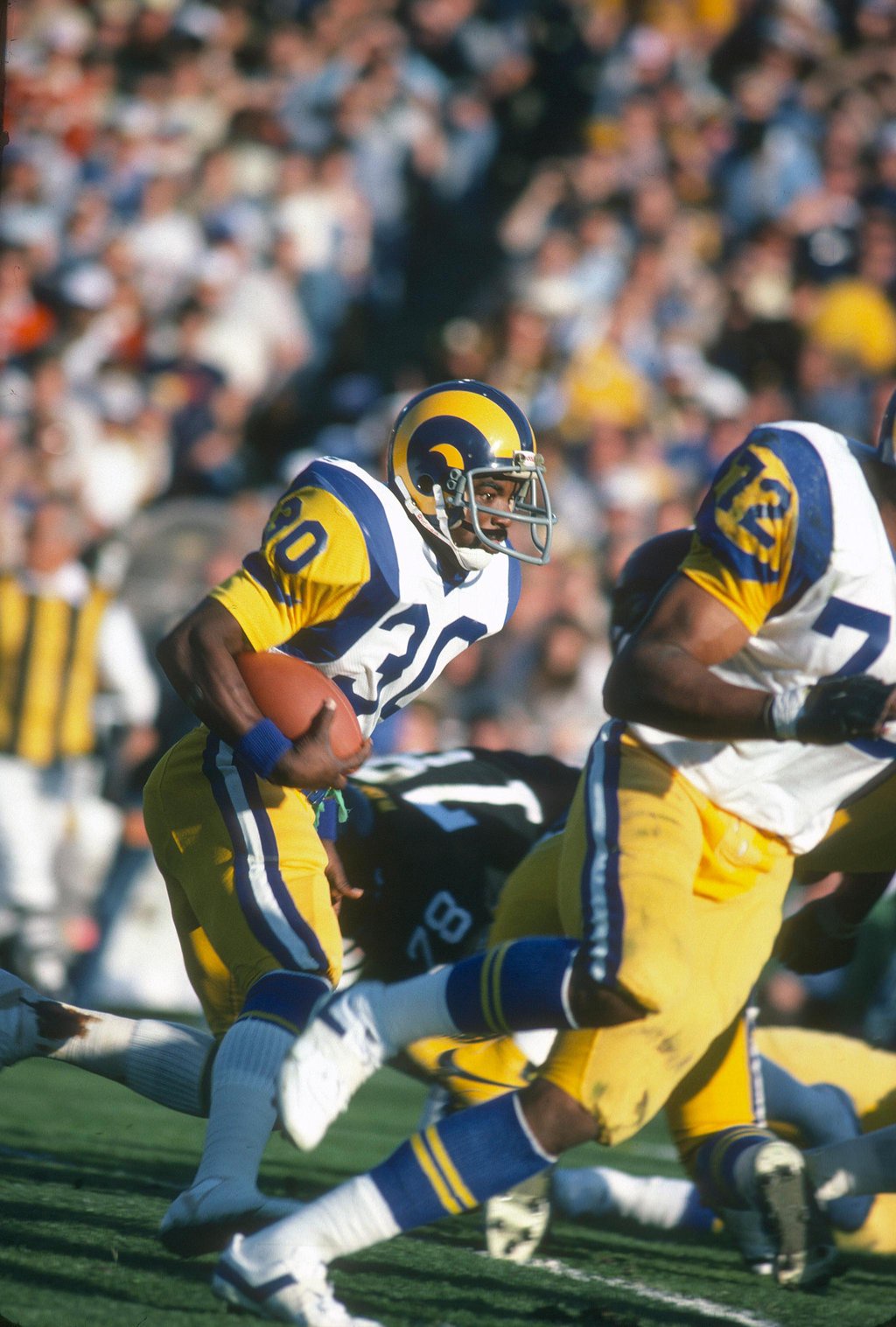 Los Angeles Rams player carries the football during Super Bowl XVI against the Pittsburgh Steelers.