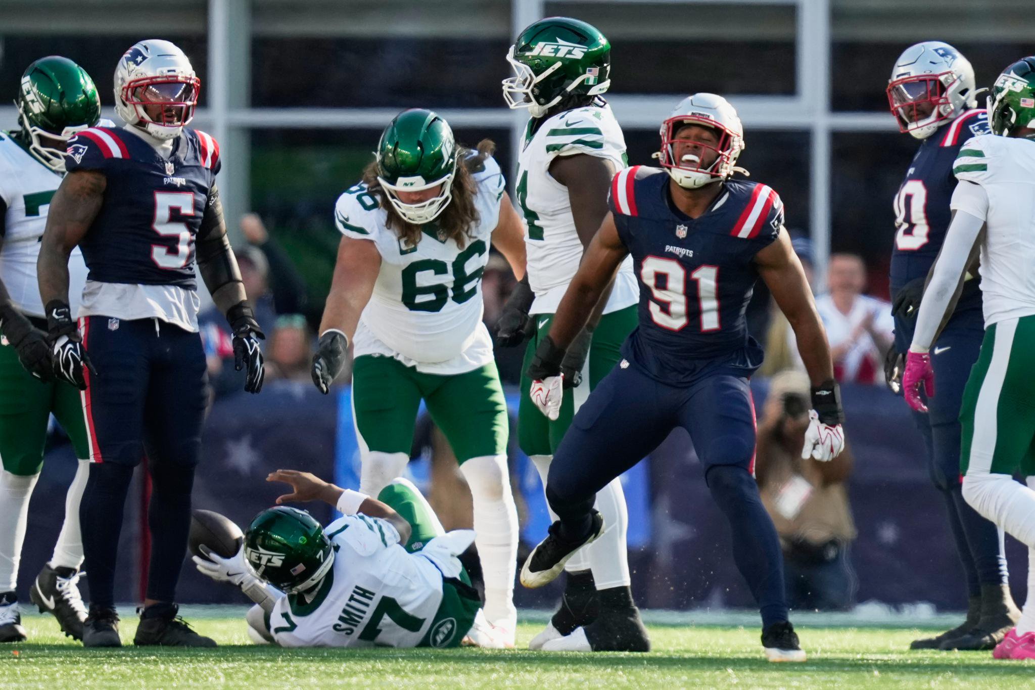 New England Patriots linebacker Elijah Ponder (91) celebrates after sacking New York Jets quarterback Geno Smith (7) during the second half of an NFL football game in Foxborough, Mass., Sunday, Oct. 18, 2026.