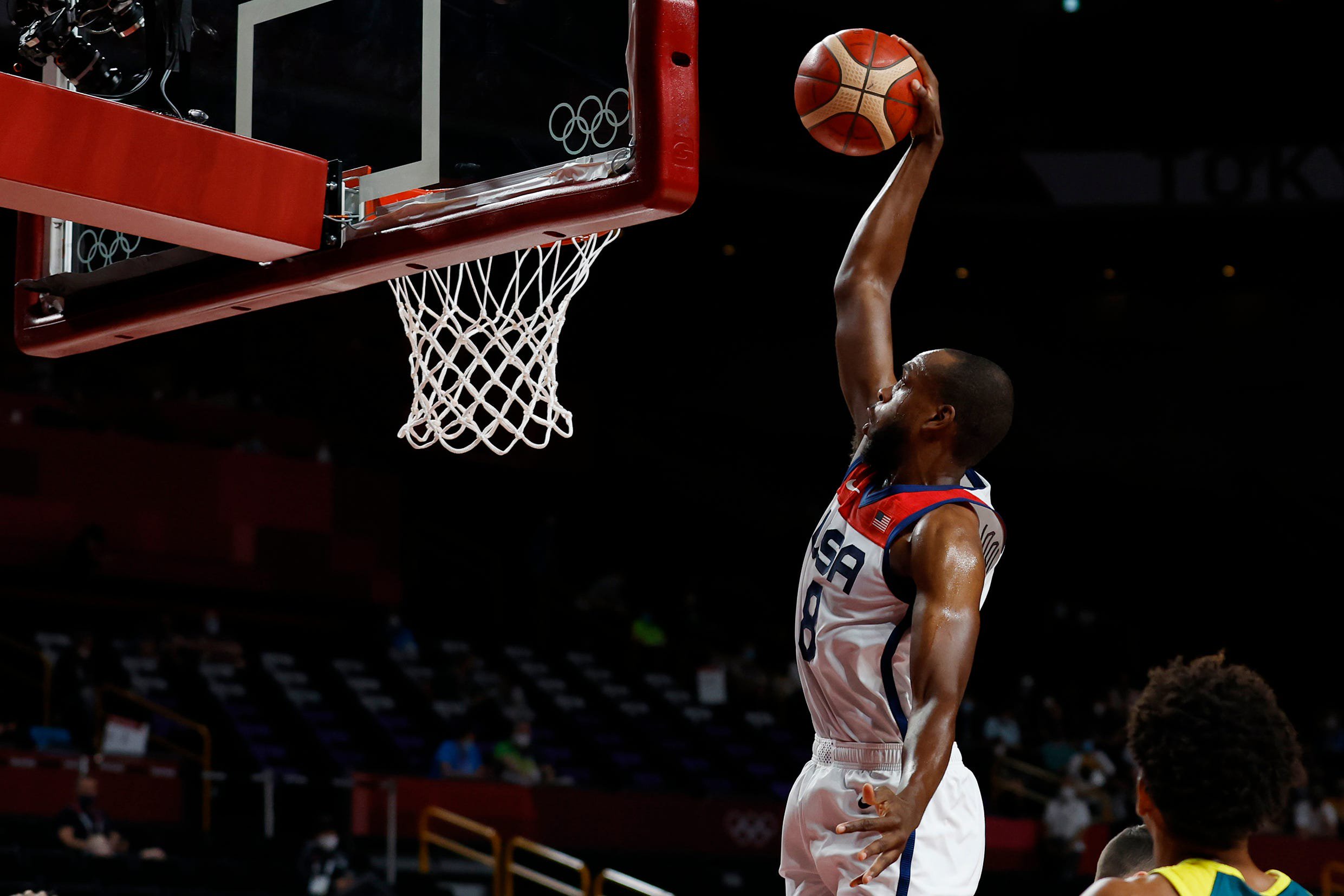 Aug 5, 2021; Saitama, Japan; United States forward Kris Middleton (8) attempts to dunk the ball against Australia in the first quarter during the Tokyo 2020 Olympic Summer Games at Saitama Super Arena. Mandatory Credit: Geoff Burke-USA TODAY Sports
