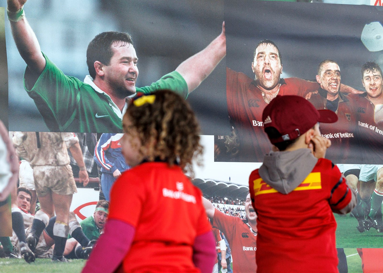 Young supporters look at the tribute to Anthony Foley ahead of the match at Páirc Uí Chaoimh. Photograph: Dan Clohessy/Inpho