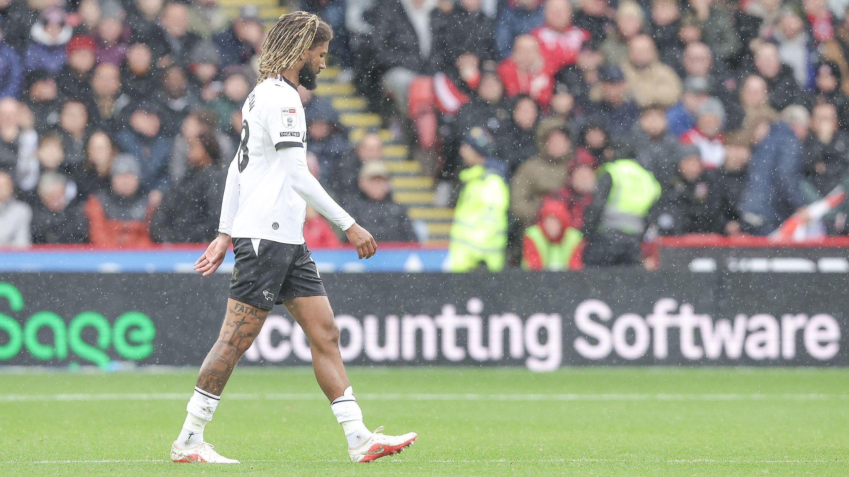 Dion Sanderson walks off the pitch after being given a red card during Derby County's game against Sheffield United on Saturday