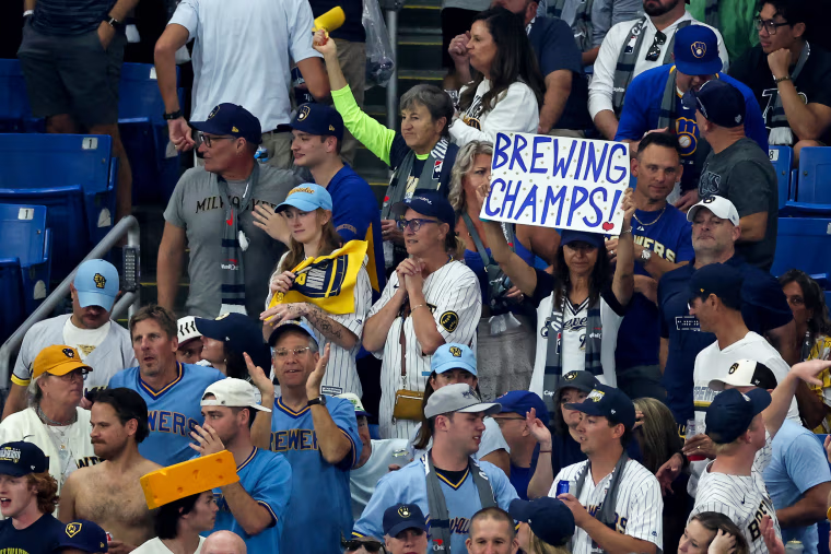 Milwaukee Brewers fans cheer during Game Three 