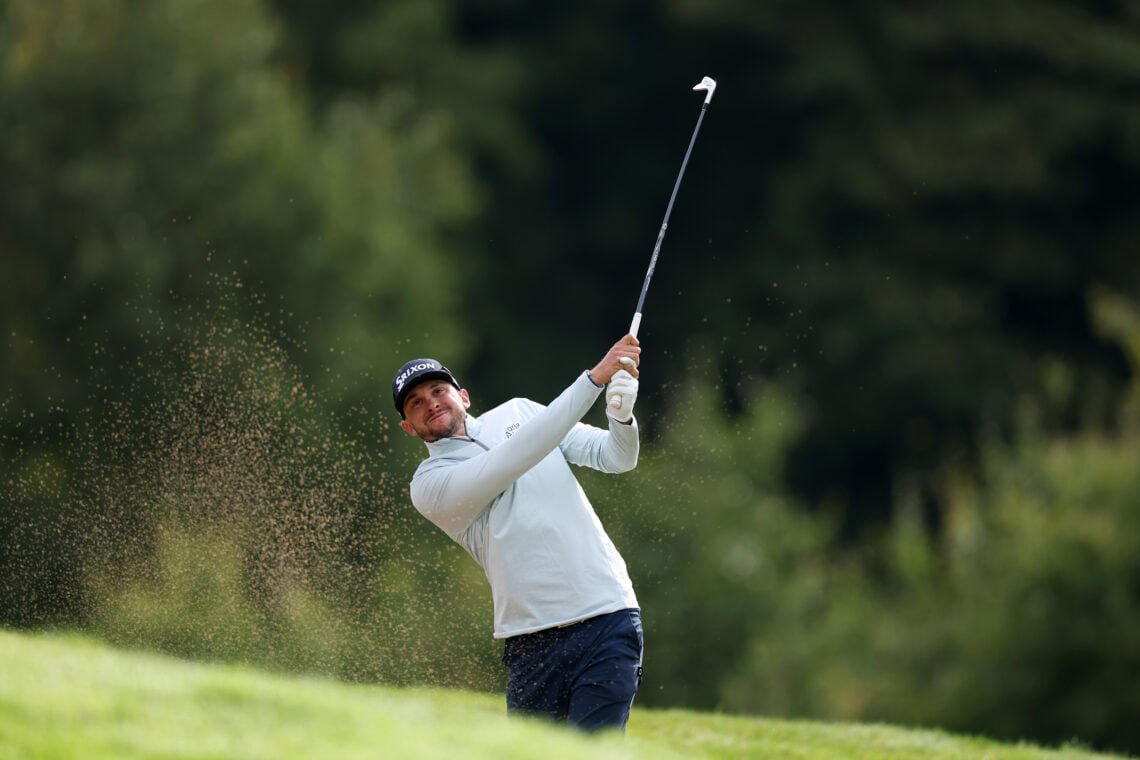 John Catlin of the United States plays his second shot on the 16th hole on day one of the Amgen Irish Open