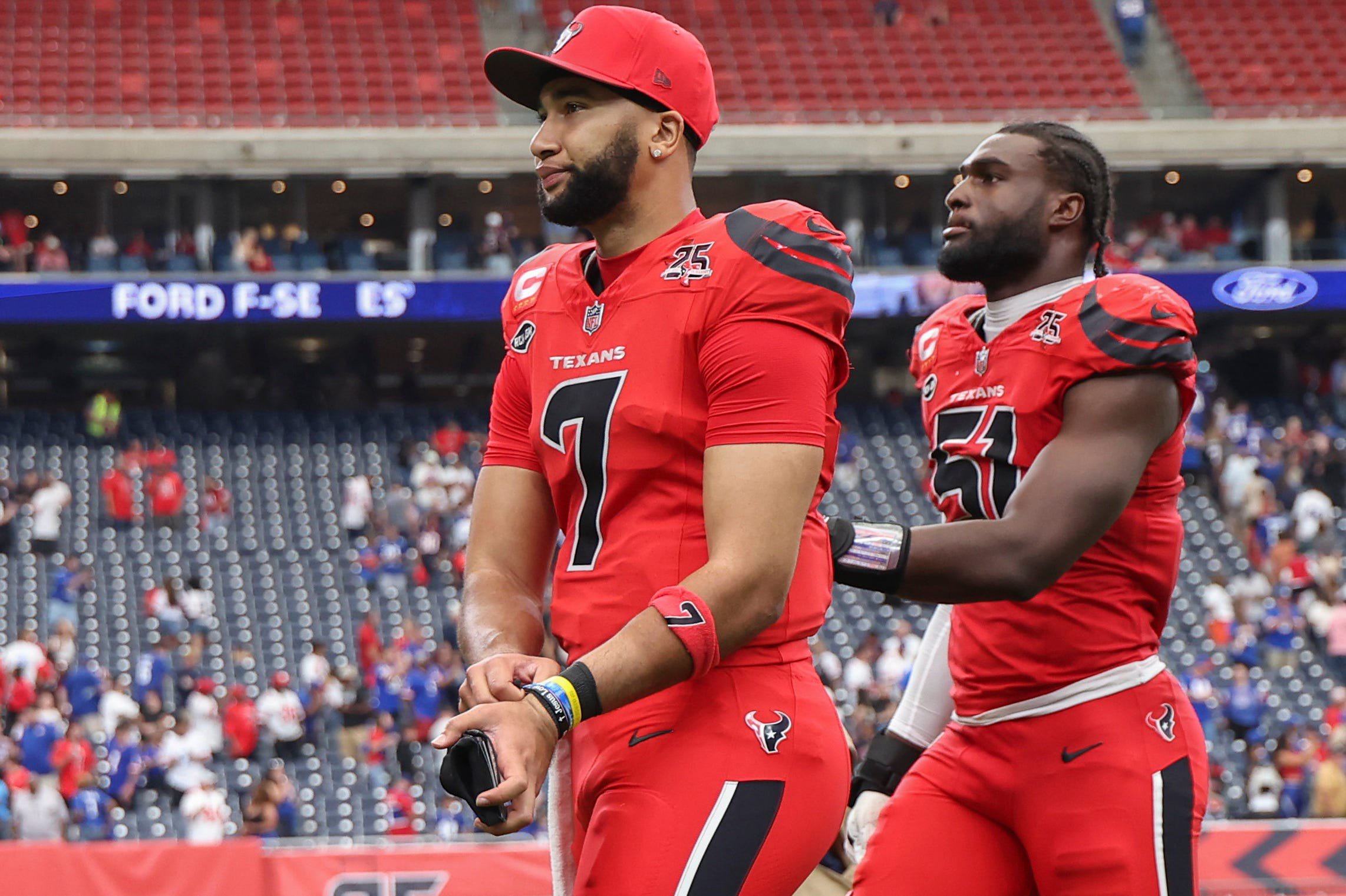 Oct 25, 2026; Houston, Texas, USA;  Houston Texans quarterback C.J. Stroud (7) and defensive end Will Anderson Jr. (51) walk off the field after the game against the New York Giants at Reliant Stadium.  Mandatory Credit: Troy Taormina-Imagn Images
