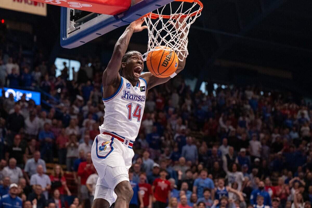 Kansas Jayhawks guard Melvin Council Jr. (14) dunks the ball in the first half of an exhibition game vs. the Louisville Cardinals on Wednesday, October 21, 2026, at Allen Fieldhouse.