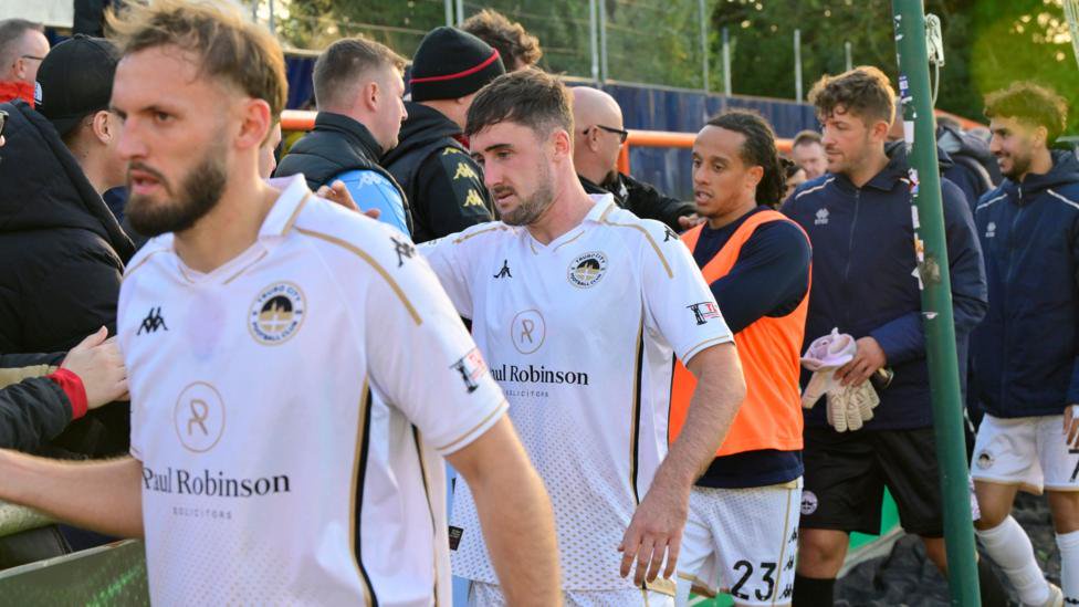 Truro City players greet supporters