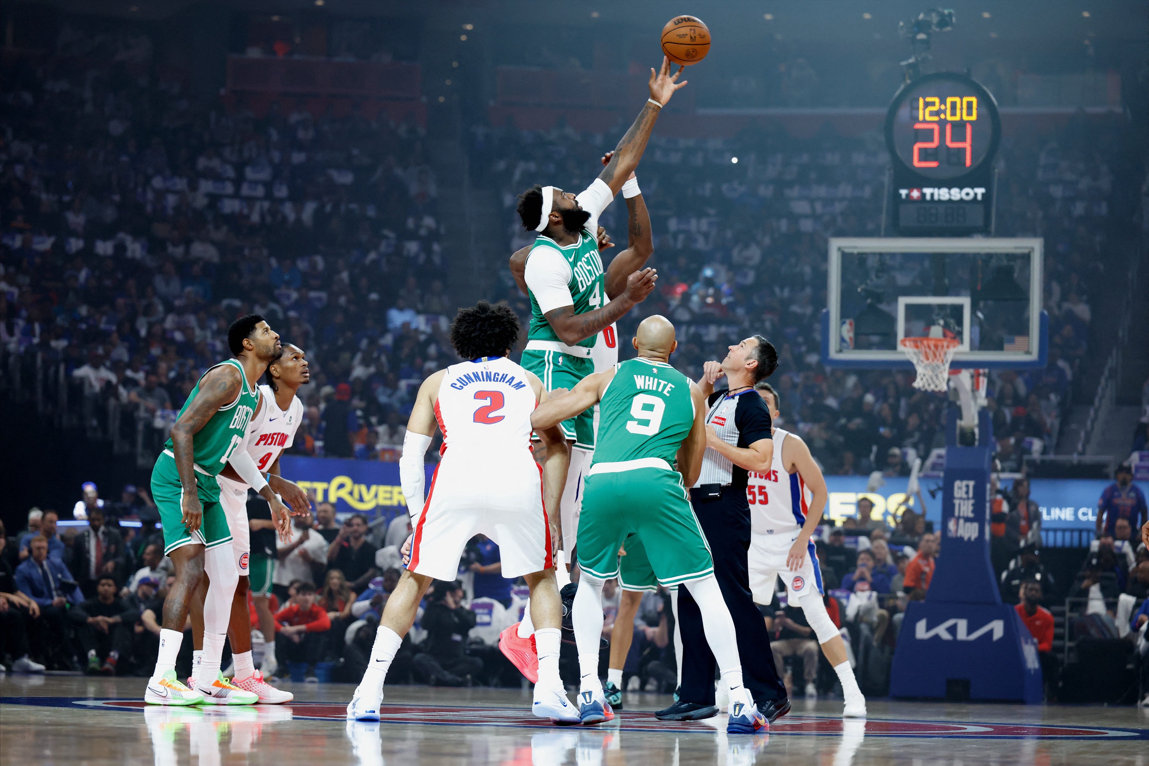 Oct 20, 2026; Detroit, Michigan, USA;  Detroit Pistons center Jalen Duren (0) and Boston Celtics center-forward Mitchell Robinson (4) tip off in the first half at Little Caesars Arena.  Mandatory Credit: Rick Osentoski-Imagn Images