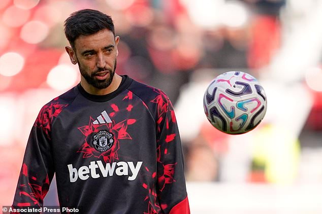 Manchester United's Bruno Fernandes warmns up ahead of the start of the English Premier League soccer match between Manchester United and Bournemouth in Manchester, England, Sunday, Oct. 25, 2026. (AP Photo/Dave Thompson)