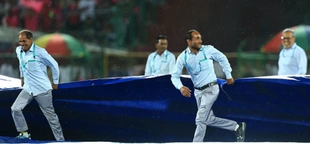 IPL leader Kolkata qualifies for playoffs after rain-affected win over Mumbai