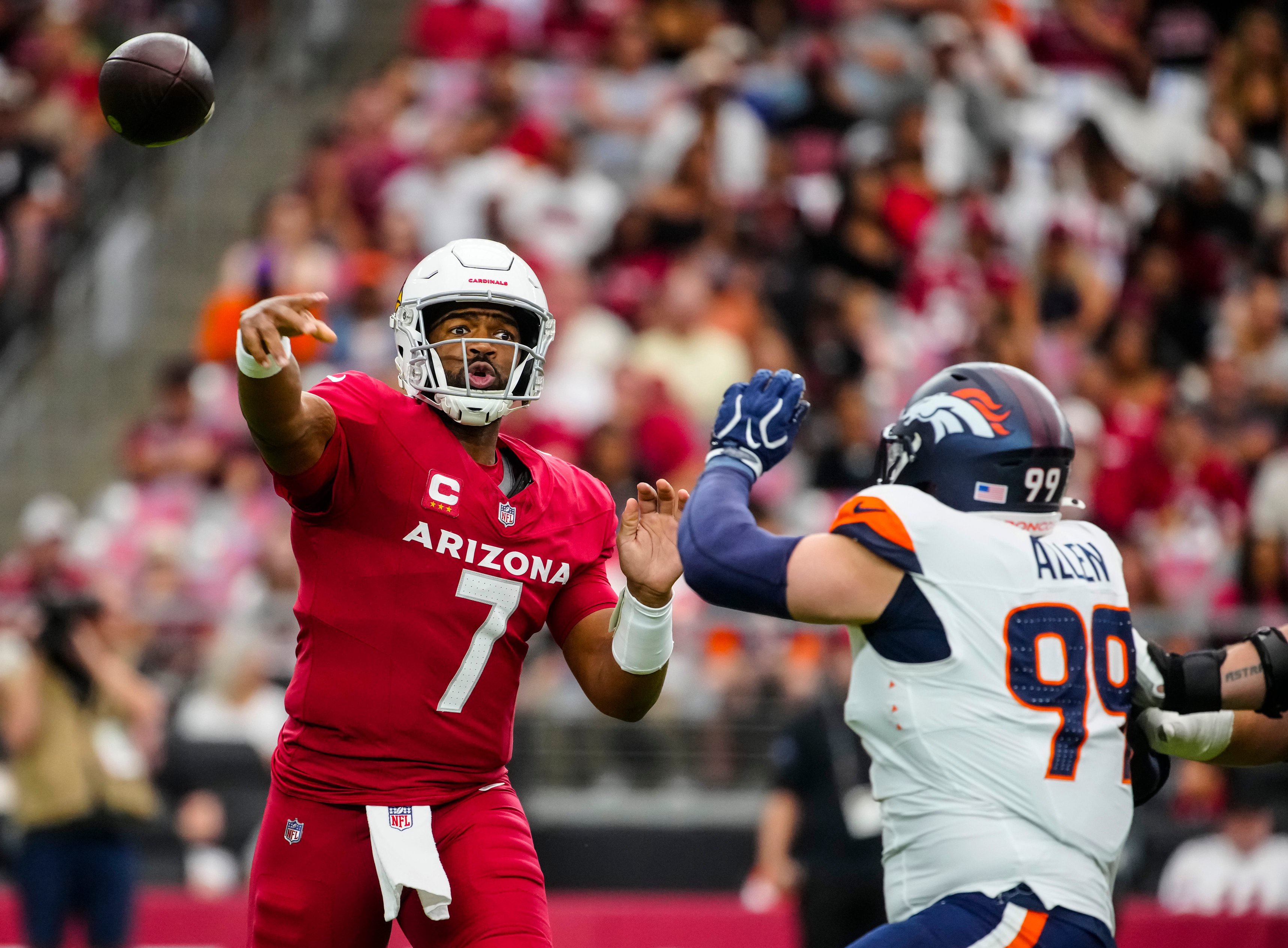 Arizona Cardinals quarterback Jacoby Brissett (7) throws a pass under pressure from Denver Broncos defensive lineman Zach Allen (99) during a game at State Farm Stadium in Glendale, Ariz. on Oct. 24, 2026.