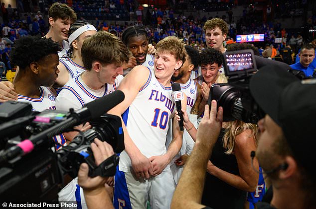 FILE - Florida forward Thomas Haugh (10) gives a post game interview after an NCAA college basketball game against Arkansas, Feb. 28, 2026, in Gainesville, Fla. (AP Photo/Noah Lantor, File)