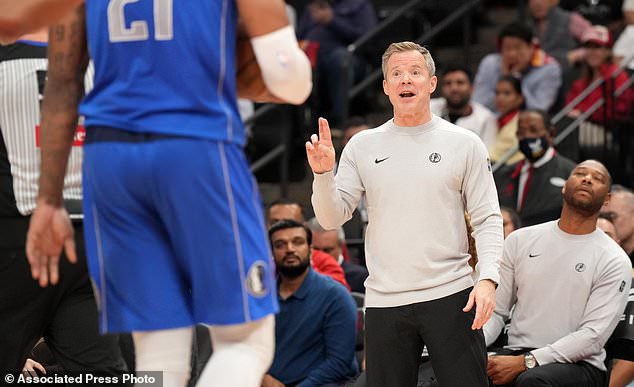 Dallas Mavericks head coach Dusty May reacts on the sidelines during the first half of an NBA basketball game against the Houston Rockets, Wednesday, Oct. 21, 2026, in Houston. (AP Photo/Karen Warren)