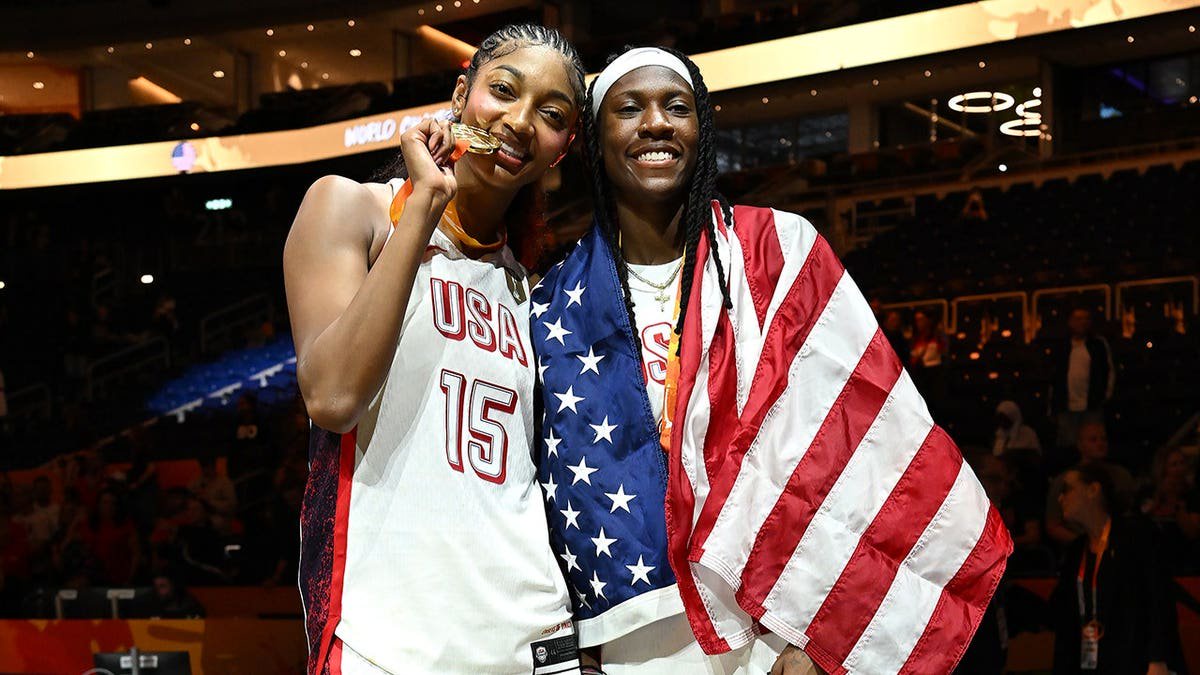 Angel Reese and Rhyne Howard of USA Basketball pose for a photo after the game in Berlin.