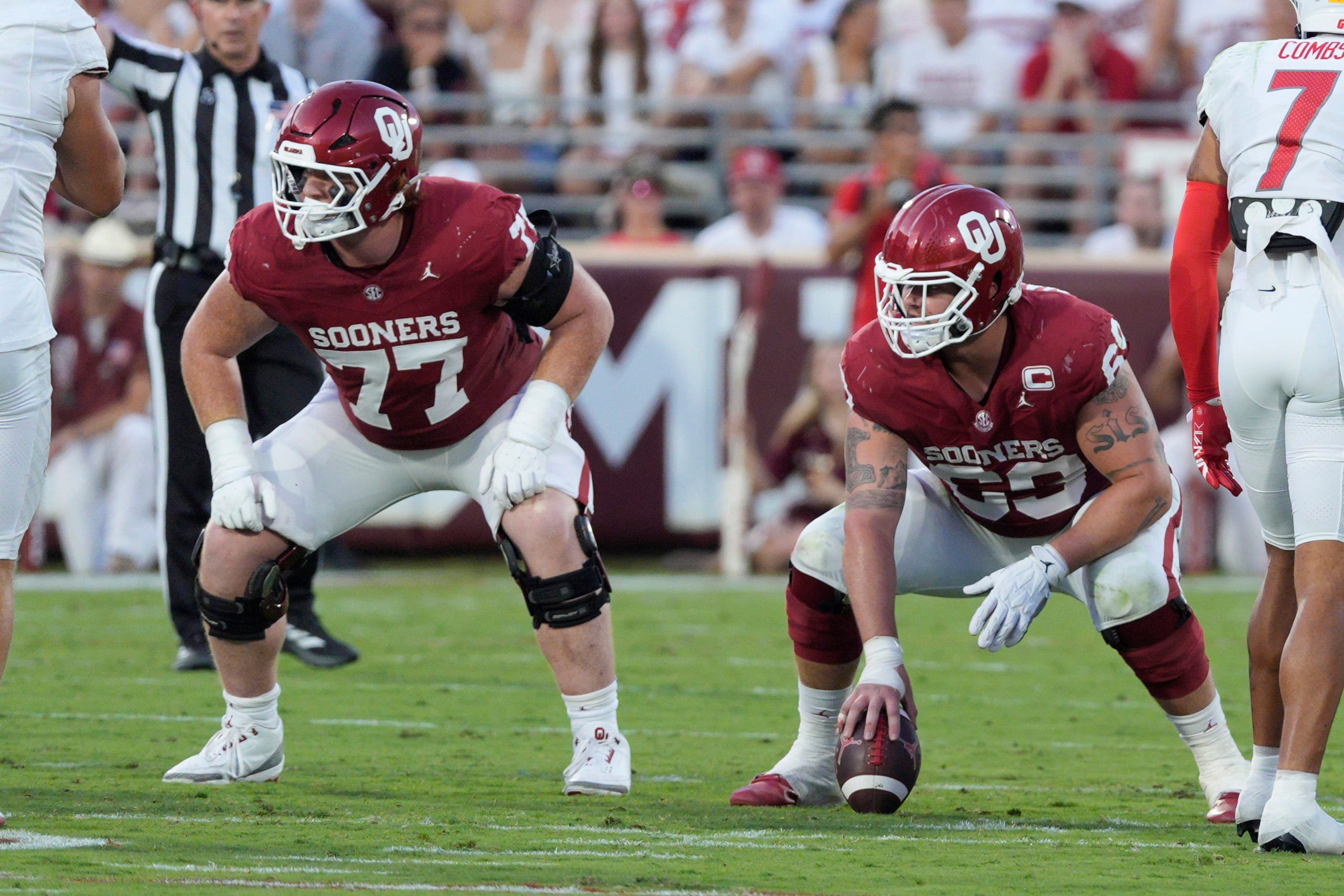 Oklahoma Sooners offensive lineman Jake Maikkula (69) and offensive lineman Heath Ozaeta (77) line up during a college football game between the University of Oklahoma Sooners (OU) and the New Mexico Lobos at Gaylord Family-Oklahoma Memorial Stadium in Norman, Okla., Saturday, Sept. 19, 2026. Oklahoma won 14-6.