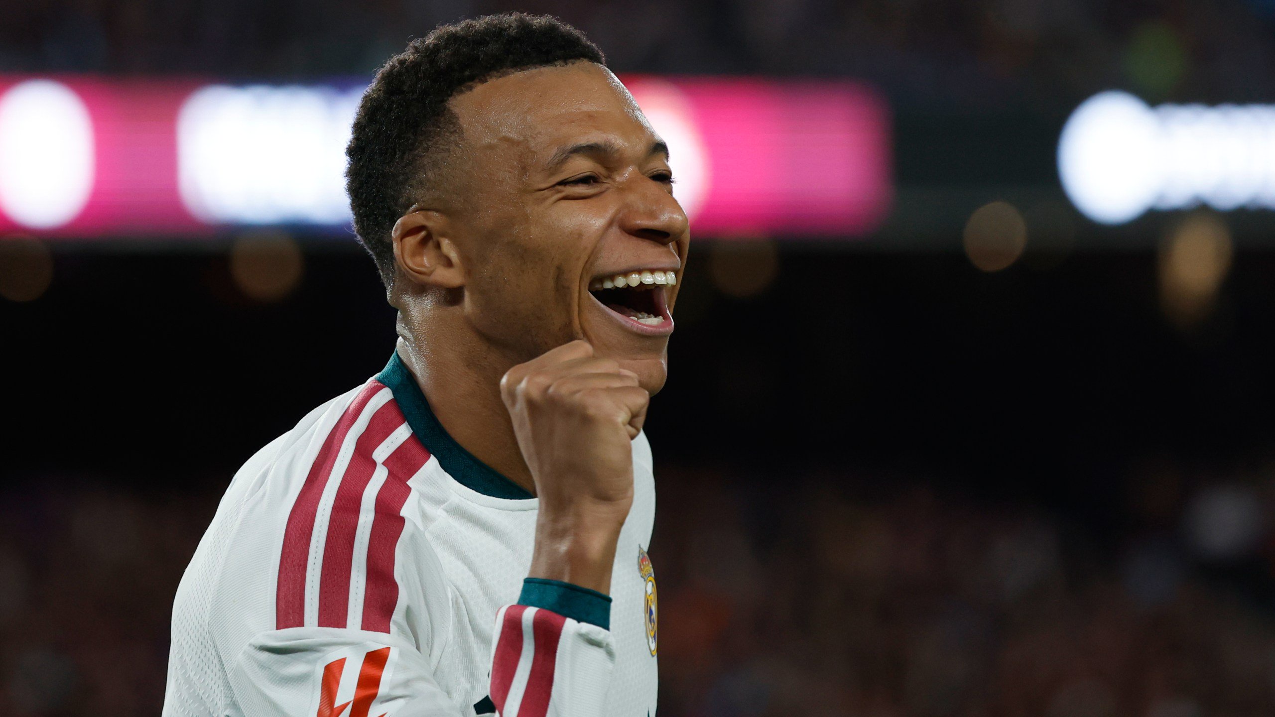 Real Madrid's Kylian Mbappe celebrates after scoring his side's opening goal during a Spanish La Liga soccer match between FC Barcelona and Real Madrid in Barcelona, Spain, Sunday, Oct. 25, 2026. (AP Photo/Joan Monfort)