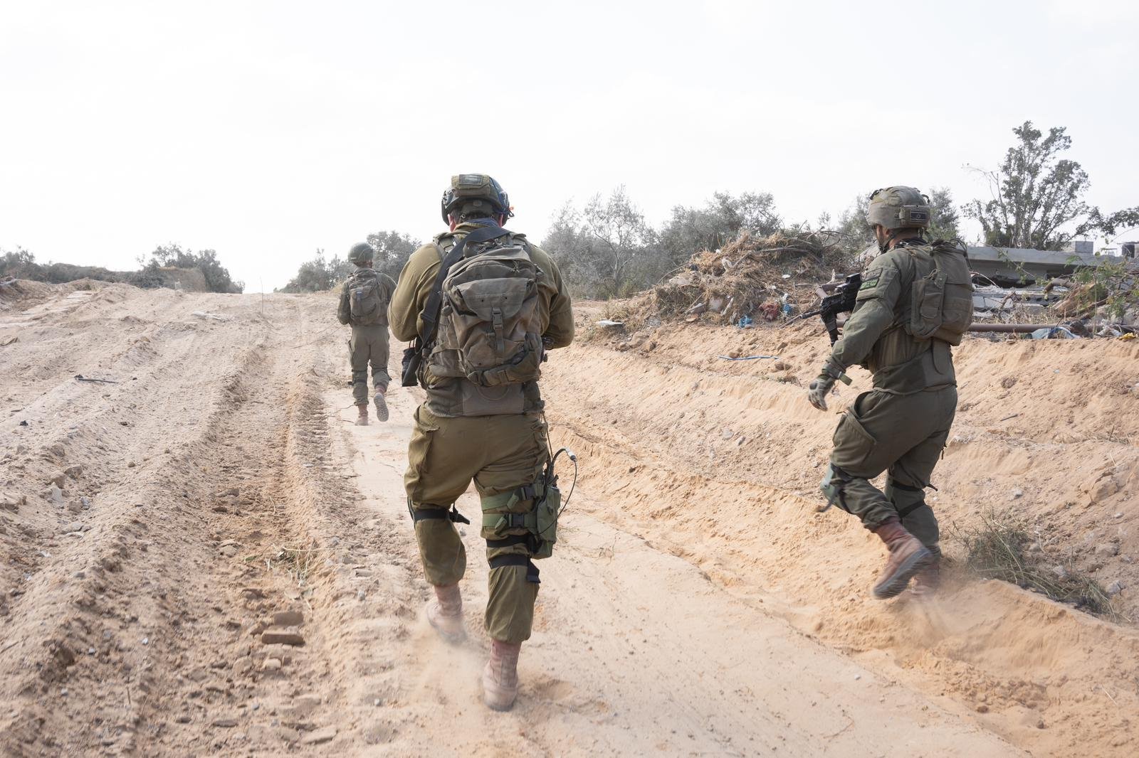 Israeli troops conduct a military operation in the central Gaza Strip