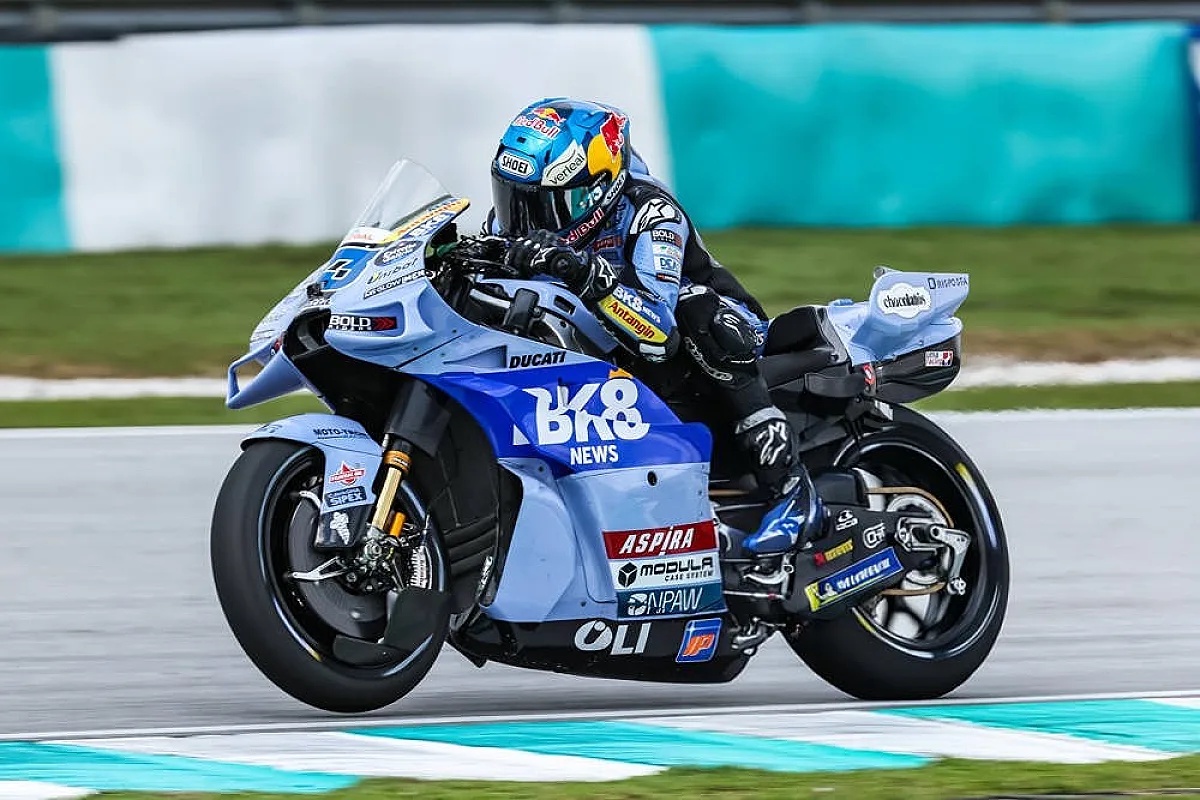 Alex Marquez on a blue Gresini Ducati MotoGP bike at Sepang, Malaysia, leaning into a corner during practice