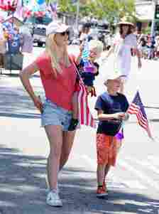 Heidi Montag with her two sons holding american flags