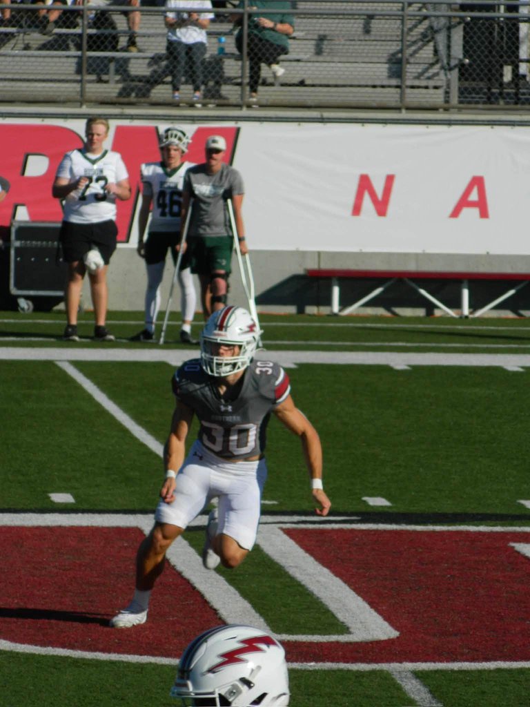 College football player Tyler Ulrich on the field during a game.