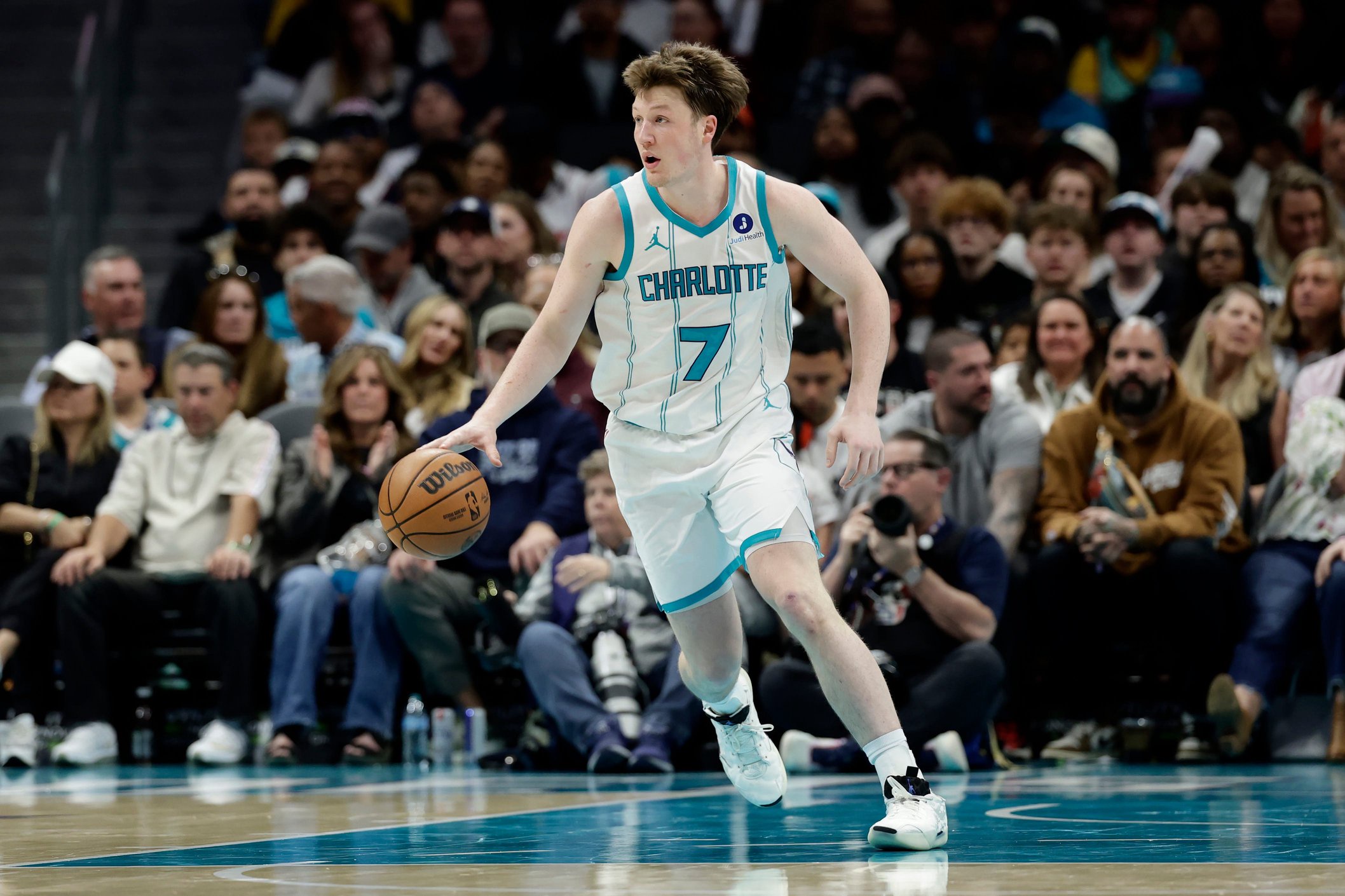 Mar 28, 2026; Charlotte, North Carolina, USA; Charlotte Hornets guard/forward Kon Knueppel (7) dribbles the ball up the court during the fourth quarter against the Philadelphia 76ers at Spectrum Center. Mandatory Credit: Brian Westerholt-Imagn Images