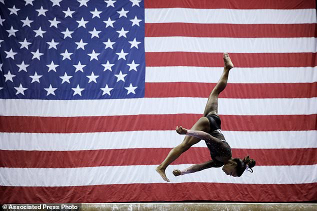FILE - Simone Biles competes in the beam during the senior women's competition at the 2019 U.S. Gymnastics Championships Sunday, Aug. 11, 2019, in Kansas City, Mo. (AP Photo/Charlie Riedel, File)