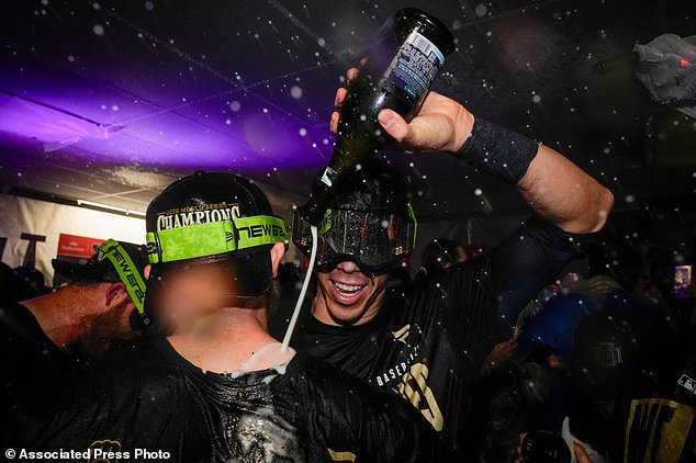Milwaukee Brewers designated hitter Christian Yelich celebrates with teammates after winning baseball's World Series, against the Tampa Bay Rays, Wednesday, Oct. 28, 2026, in St. Petersburg, Fla. (AP Photo/Chris O'Meara)