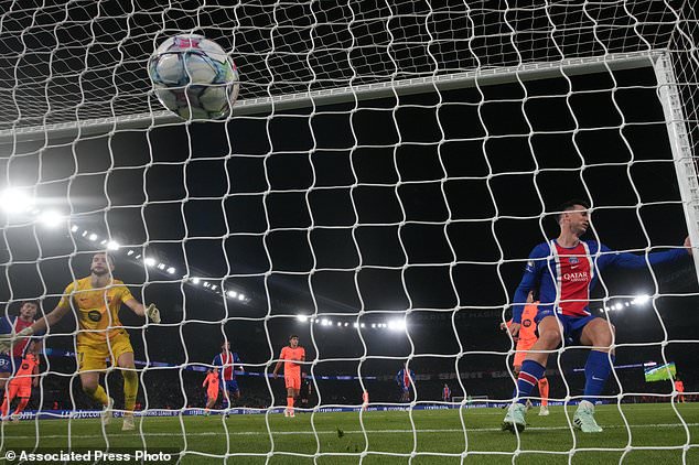 PSG's Fabian Ruiz scores their fourth goal during the Champions League opening phase soccer match between Paris Saint-Germain and FC Barcelona in Paris, Tuesday, Oct. 20, 2026. (AP Photo/Teresa Suarez)