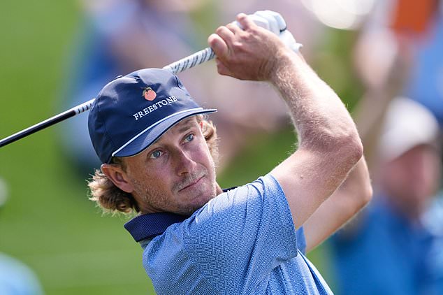 FILE - Austin Smotherman hits off the 18th tee during the second round of The Players Championship golf tournament Friday, March 13, 2026, in Ponte Vedra Beach, Fla. (AP Photo/Gerald Herbert, file)