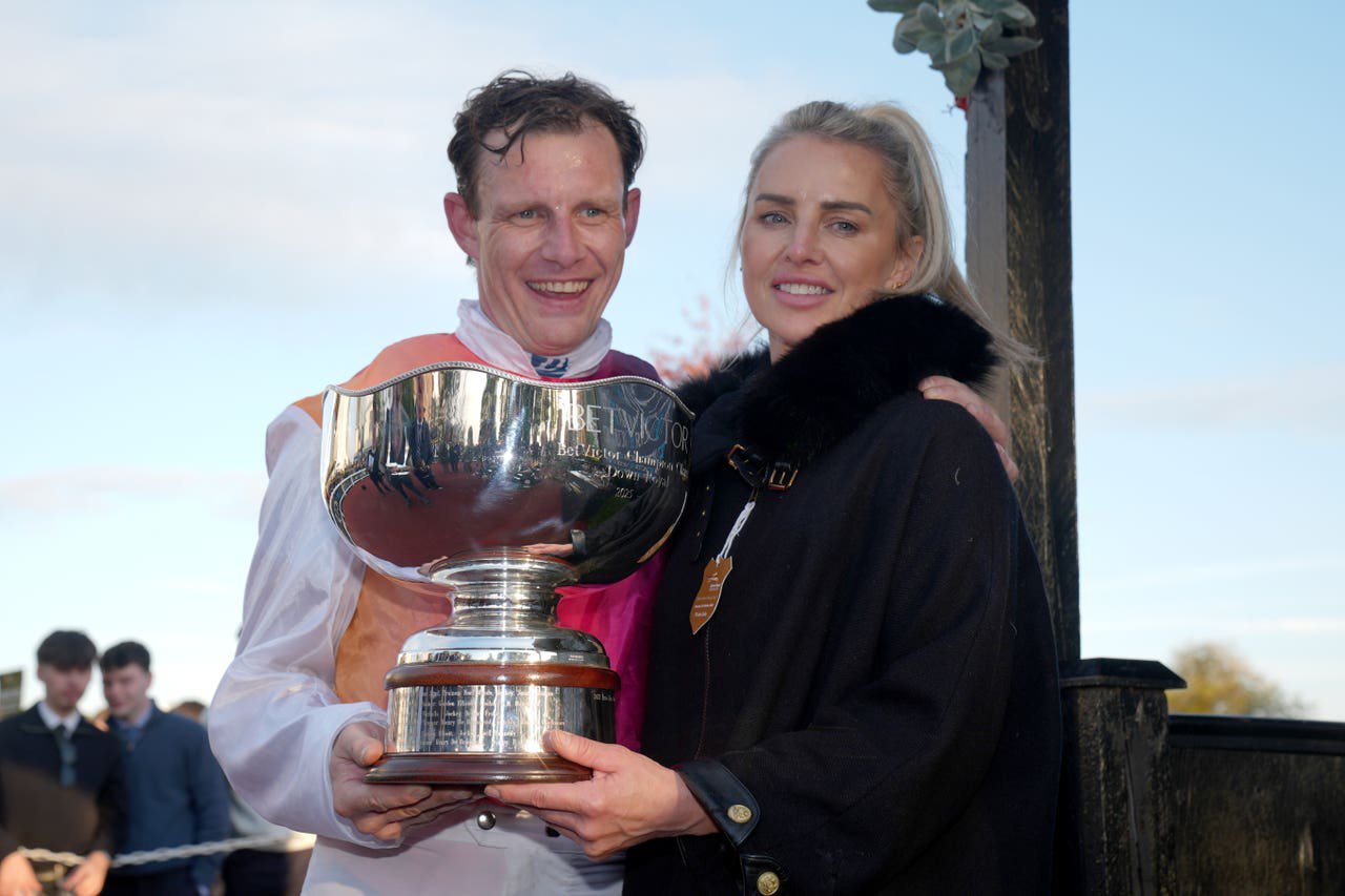 Jockey Paul Townend and trainer Rebecca Curtis with the trophy