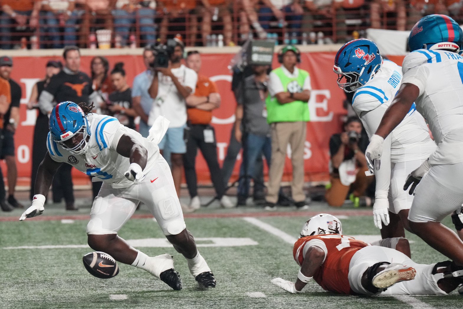 Oct 24, 2026; Austin, Texas, USA;  Mississippi Rebels defensive tackle Jehiem Oatis (9) reaches for a fumble during the second half against the Texas Longhorns at Darrell K Royal-Texas Memorial Stadium.  Mandatory Credit: Scott Wachter-Imagn Images