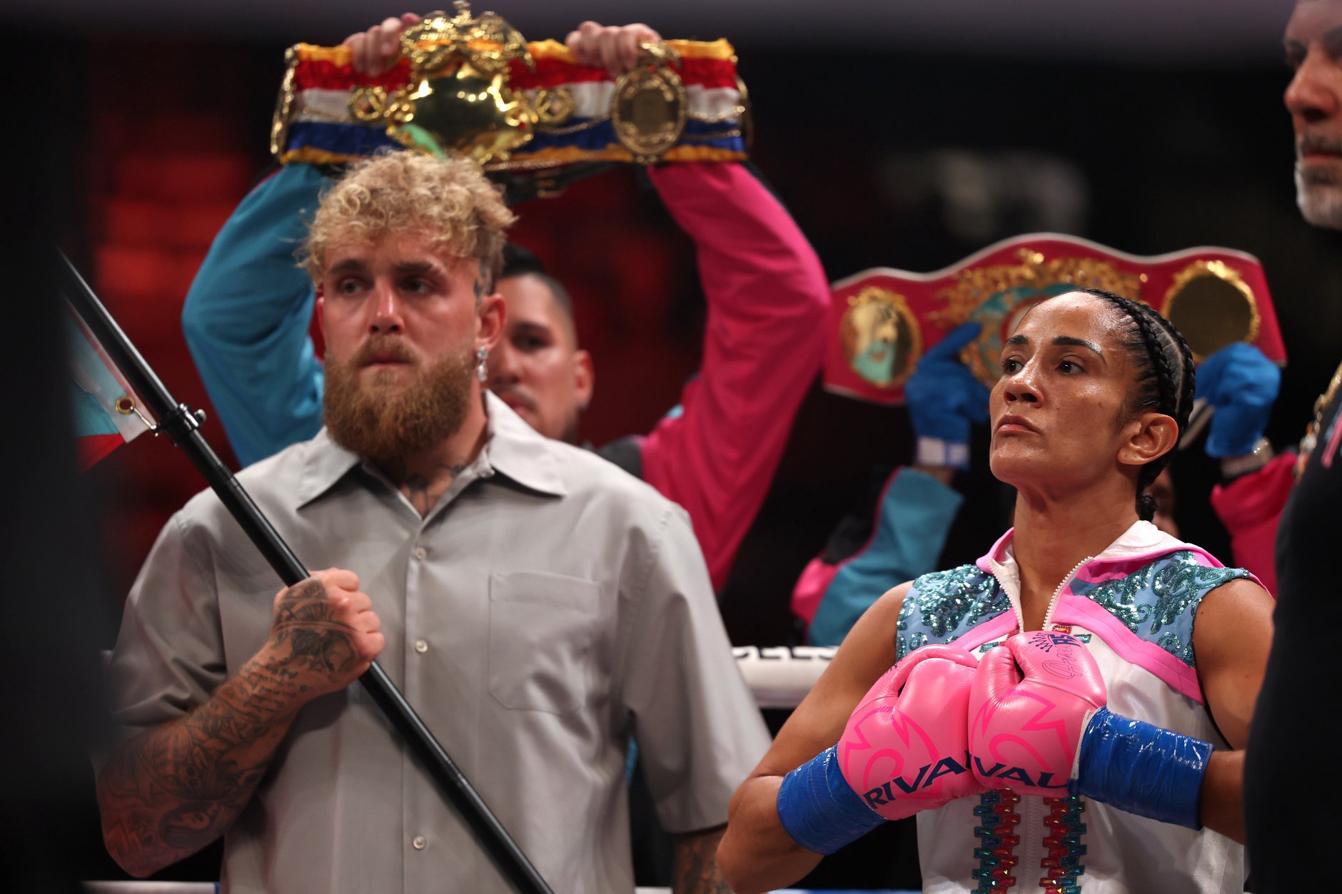 SAN JUAN, PUERTO RICO - JANUARY 03: Amanda Serrano stands next to Jake Paul in the ring prior to her bout against Reina Tellez for the unified World Featherweight Championship at Coliseo Roberto Clemente on January 03, 2026 in San Juan, Puerto Rico. (Photo by Ricardo Arduengo/Getty Images)