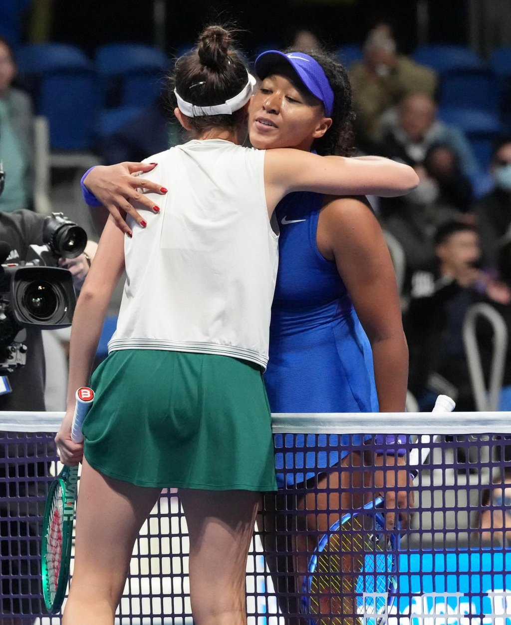 Japan’s Naomi Osaka (right) embraces Mia Pohankova after losing to the Slovak. Photo: Kyodo