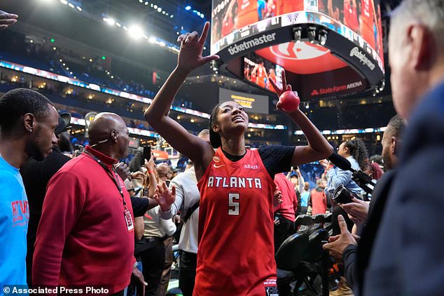 Atlanta Dream's Angel Reese reacts after the Dream won Game 6 of the WNBA basketball finals against the Golden State Valkyries on Thursday, Oct. 29, 2026, in Atlanta. (AP Photo/Brynn Anderson)