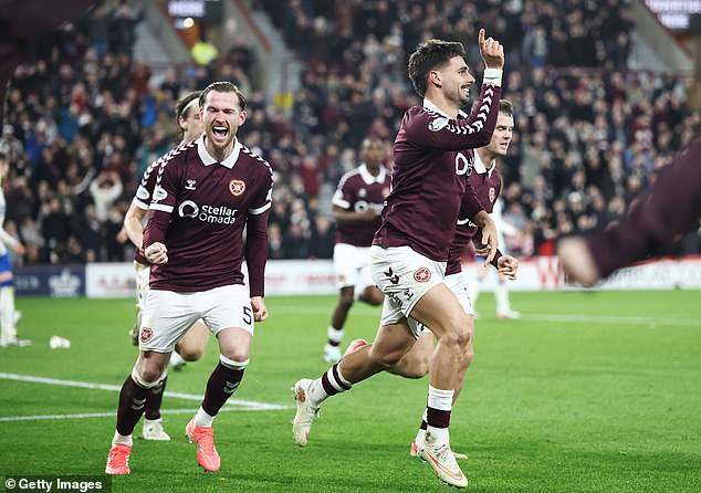 Claudio Braga celebrates his goal that pulled Hearts back into the contest