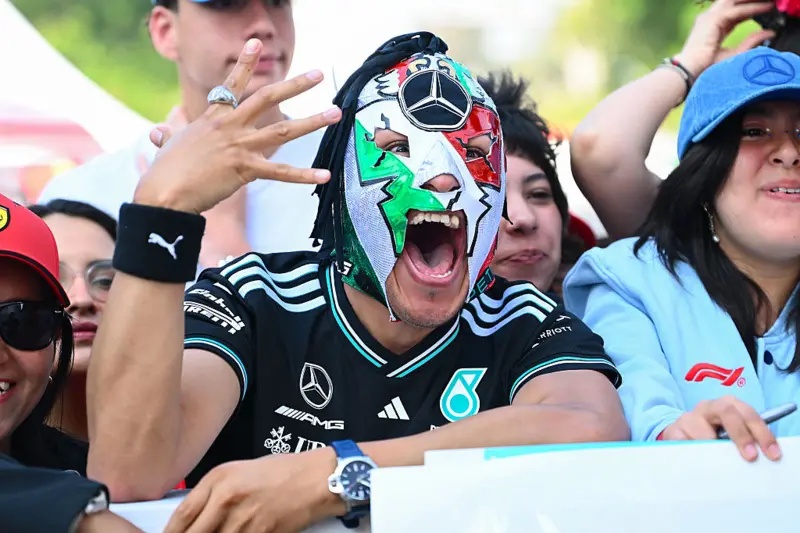A Mercedes fan dressed in a Mexican wrestler mask