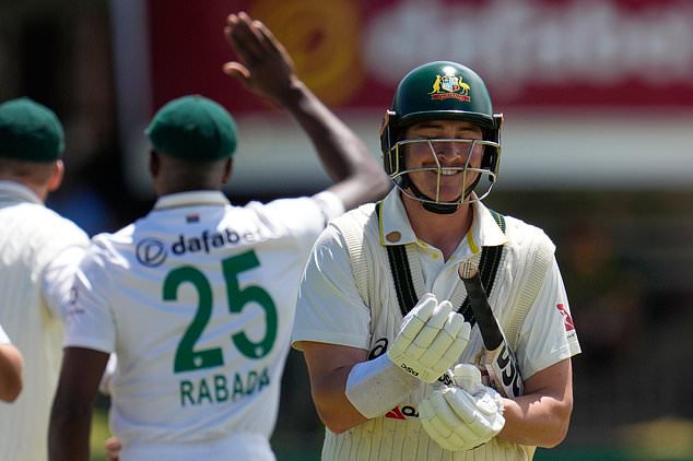 Australia's Matt Renshaw, right, walks back to pavilion after dismissal during day four of the second cricket test match between South Africa and Australia, in Gqeberha, South Africa, Wednesday, Oct. 21, 2026. (AP Photo/Themba Hadebe)