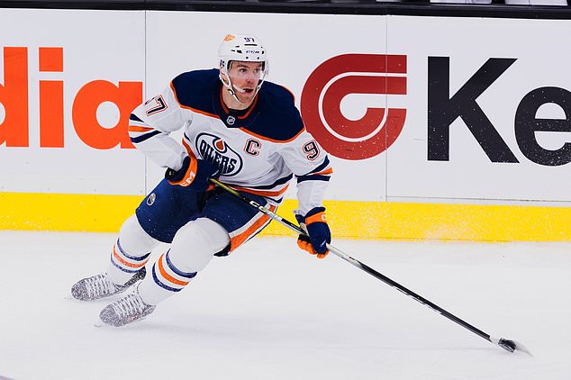Edmonton Oilers center Connor McDavid (97) skates with the puck during the first period of an NHL hockey game against the Utah Mammoth Saturday, Oct. 17, 2026, in Salt Lake City. (AP Photo/Melissa Majchrzak)