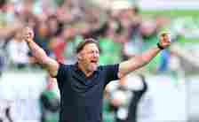 Ralph Hasenhuettl, Head Coach of VfL Wolfsburg, celebrates his team's third goal scored by Vaclav Cerny of VfL Wolfsburg (not pictured) during the ...