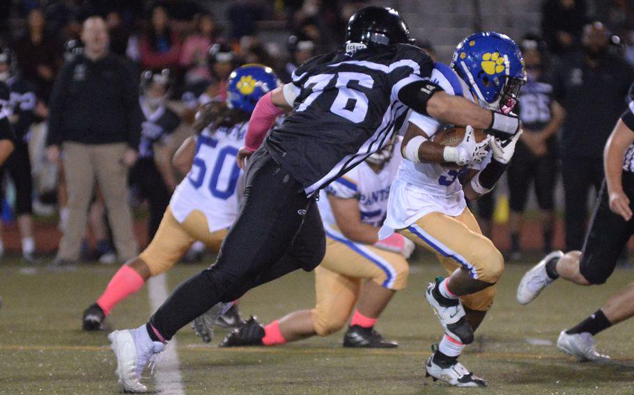 Keito Kawamura-Johnson tries to avoid the tackle of Anthony Romero.
