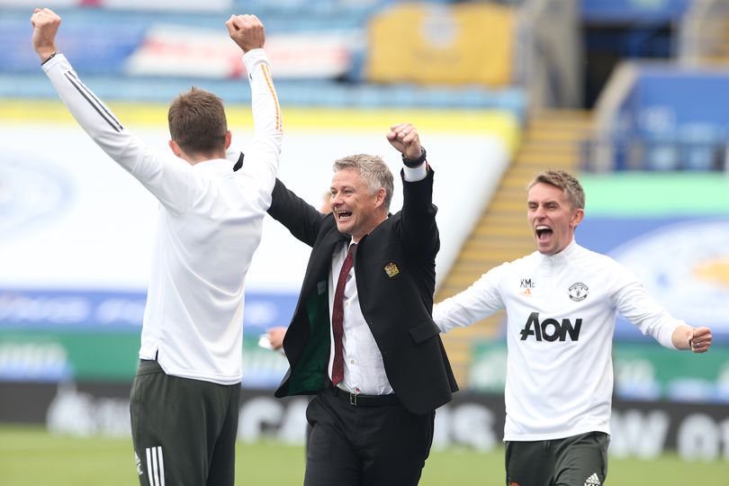 Coach Michael Carrick, Manager Ole Gunnar Solskjaer and Coach Kieran McKenna of Manchester United celebrate at the final whistle during the Premier League match between Leicester City and Manchester United at The King Power Stadium