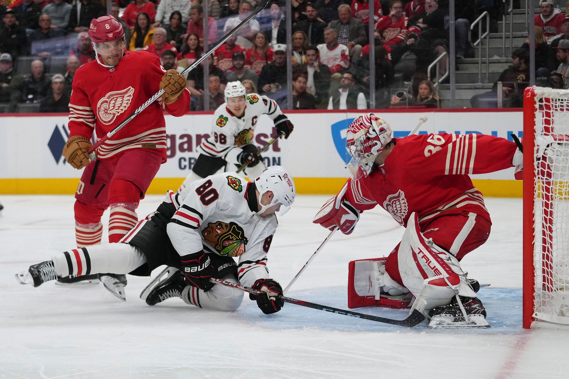 Red Wings goaltender John Gibson stops a shot from Blackhawks right wing Roman Kantserov in the second period Thursday, Oct. 29, 2026, in Detroit. (Paul Sancya/AP)