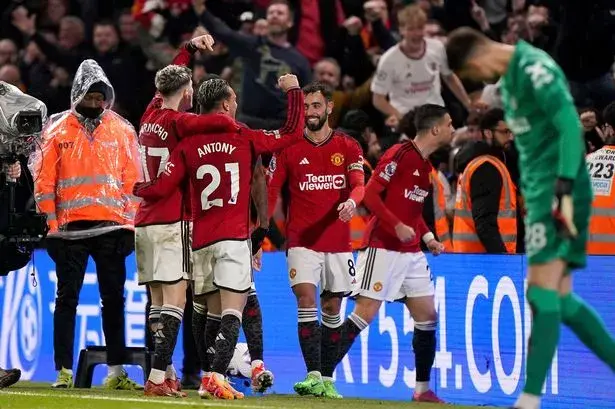 Manchester United's Alejandro Garnacho (left) celebrates with team-mate Antony after scoring their third goal of the game during the Premier League match at Stamford Bridge, London