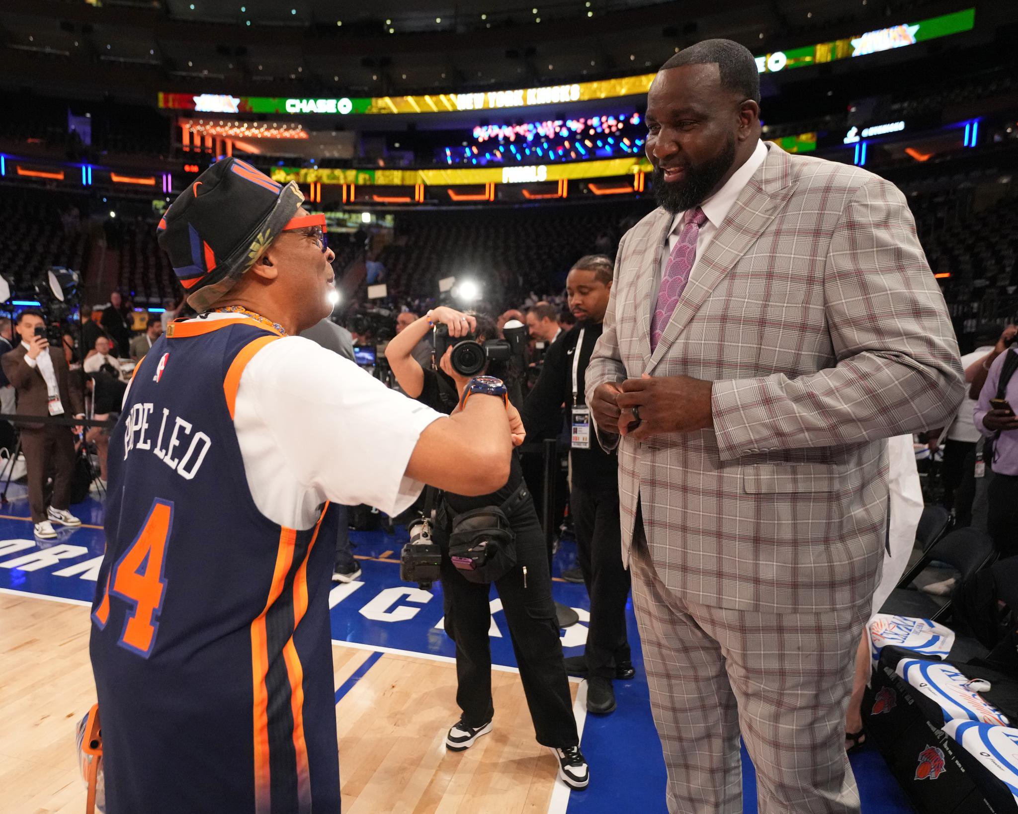 Spike Lee and Kendrick Perkins talk before the game between the San Antonio Spurs and New York Knicks during Game Three of the 2026 NBA Finals on June 8, 2026 at Madison Square Garden.