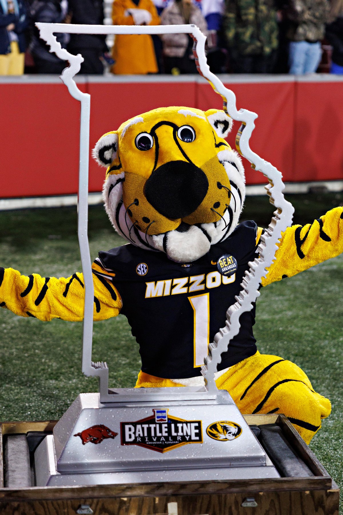 FAYETTEVILLE, ARKANSAS - NOVEMBER 29: Mascot of the Missouri Tigers poses with the Battle Line Trophy after the game against the Arkansas Razorbacks at Donald W. Reynolds Razorback Stadium on November 29, 2025 in Fayetteville, Arkansas. The Tigers defeated the Razorbacks 31-17. (Photo by Wesley Hitt/Getty Images)