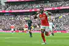 Bukayo Saka of Arsenal celebrates after scoring during the Premier League match between Tottenham Hotspur and Arsenal FC at Tottenham Hotspur Stadi...