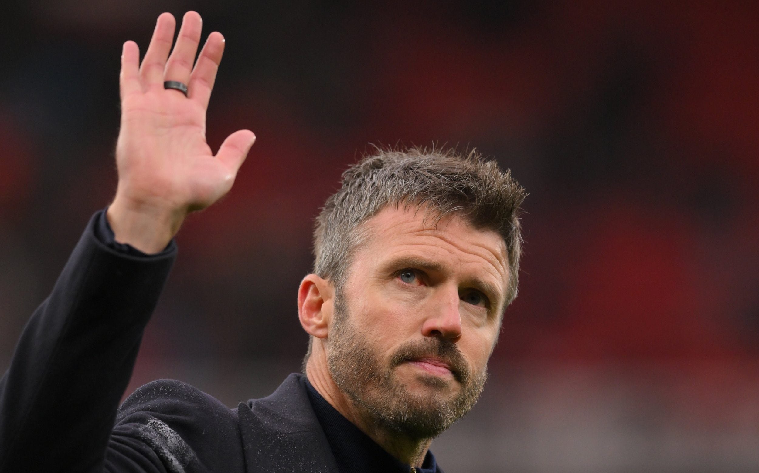 Manchester United manager Michael Carrick waves at full time
