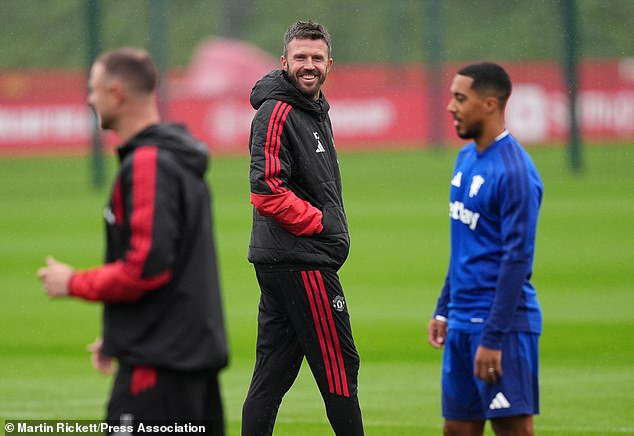 Michael Carrick pictured grinning in Man United training - but it's not all smiles at the club